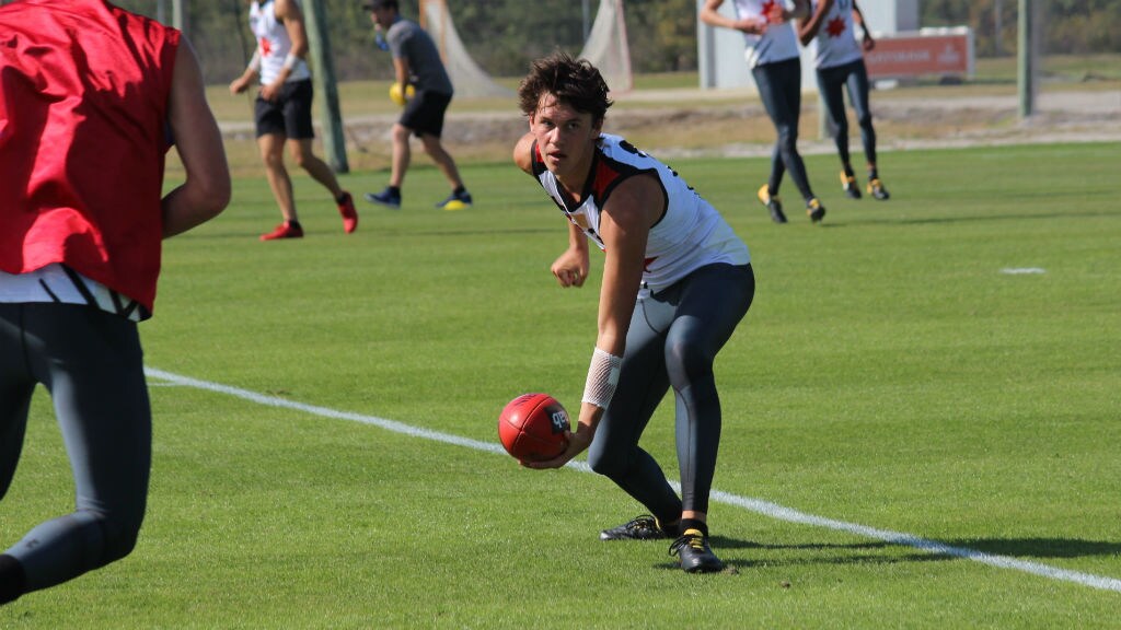 taylor landscape.jpg Curtis Taylor fires off a handball during training at the IMG Academy in Florida - AFL,AFL Academy,Draft